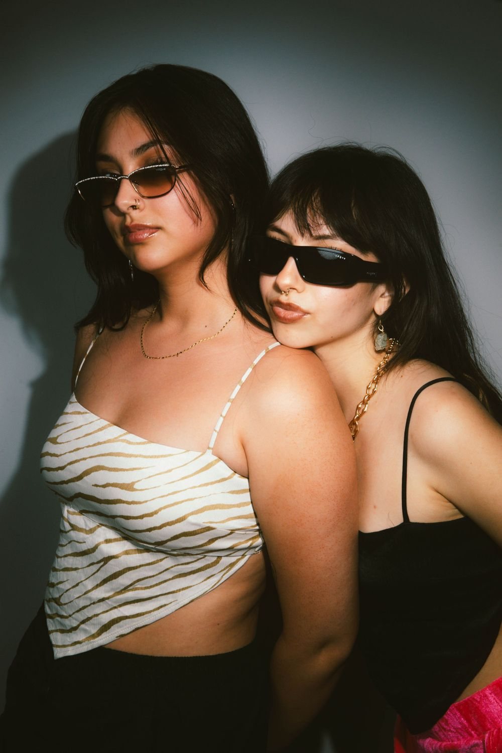 Two women in sunglasses, close together